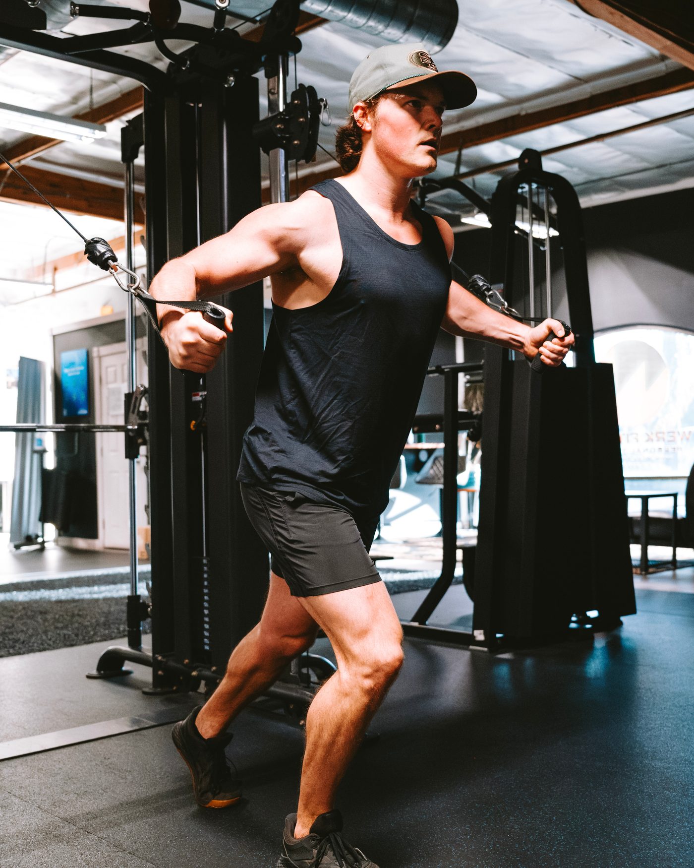 Nate training on a cable machine
