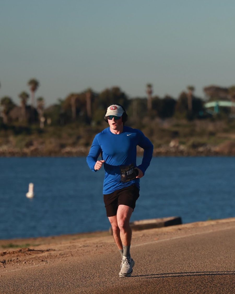 Nate running along the water